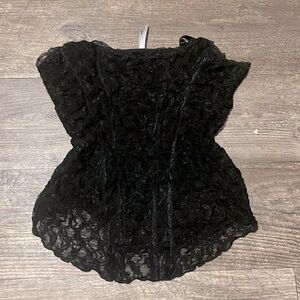 A Charlotte Russe lace top that’s u shaped at the bottom and medium sized